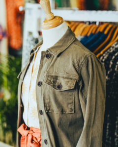 Olive green jacket on store mannequin in Brakeburn, Poole